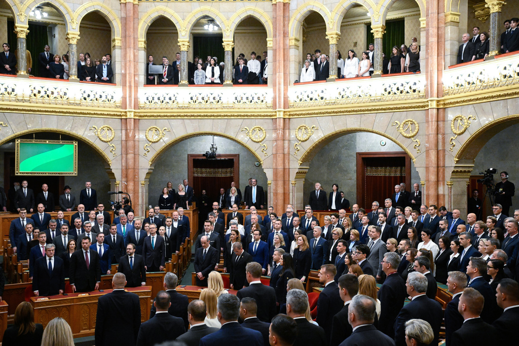 Deputies sing the national anthem during the plenary session of the new National Assembly following the appointment ceremony of the Tisza cabinet in Budapest, Hungary, Tuesday, May 12, 2026. (Boglarka Bodnar/MTI via AP) CORRECTION: byline corrected to Boglarka Bodnar instead of Tibor Illyes