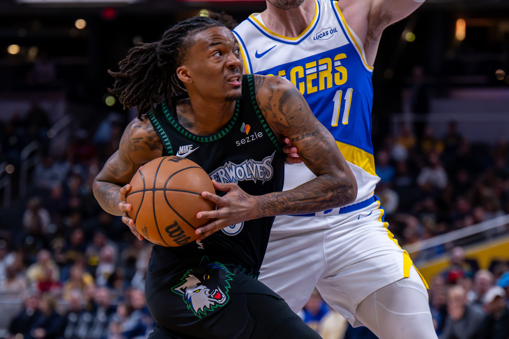 Minnesota Timberwolves guard Bones Hyland drives to the basket during the first half of an NBA basketball game against the Indiana Pacers in Indianapolis, Tuesday, April 7, 2026. (AP Photo/Doug McSchooler)