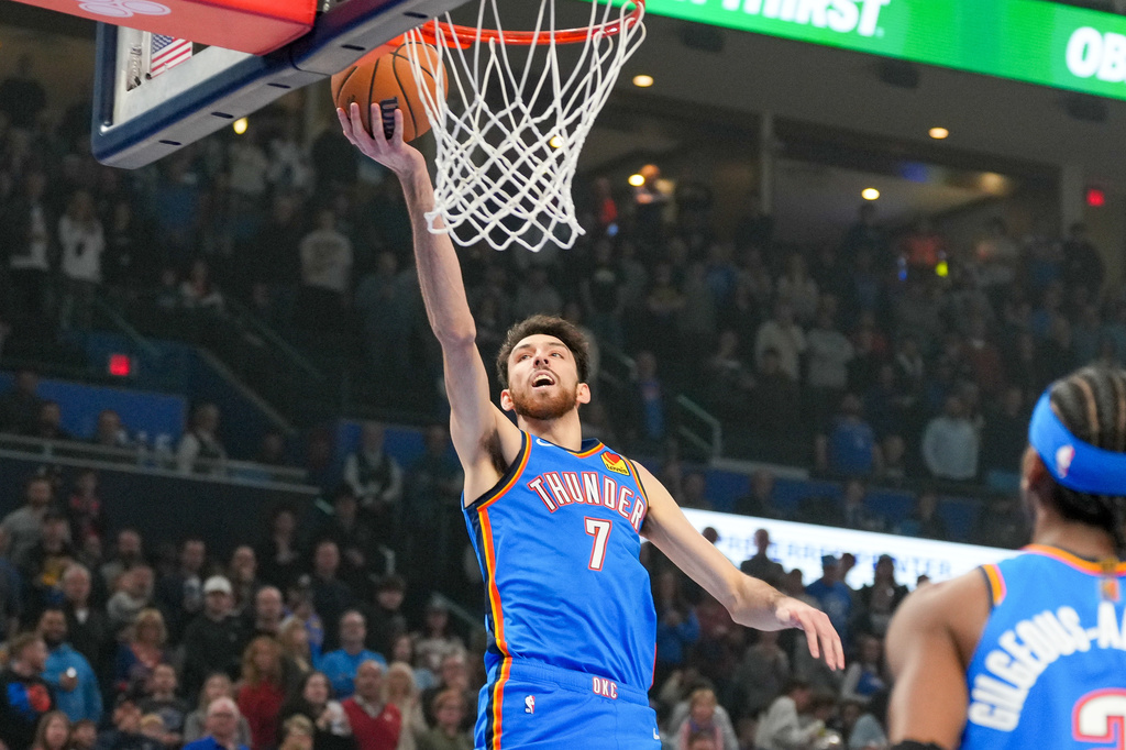 Oklahoma City Thunder center Chet Holmgren (7) shoots during the first half of an NBA basketball game against the Los Angeles Clippers, Thursday, Dec. 18, 2025, in Oklahoma City. (AP Photo/Kyle Phillips)