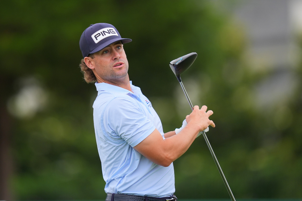 Taylor Moore watches his tee shot on the eighth hole during the first round of the Byron Nelson golf tournament in McKinney, Texas, Thursday, May 21, 2026. (AP Photo/LM Otero)