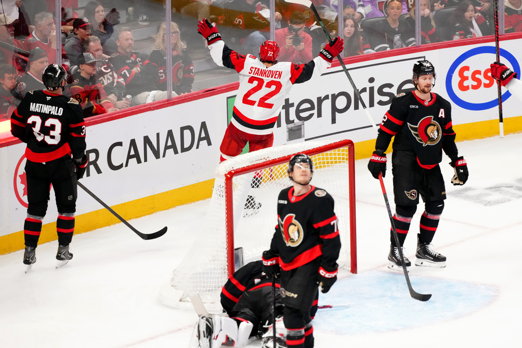 Carolina Hurricanes centre Logan Stankoven (22) celebrates his goal past Ottawa Senators goaltender Linus Ullmark (35) during the third period in Game 4 of a first-round NHL Stanley Cup playoff hockey series, Saturday, April 25, 2026, in Ottawa, Ontario. (Sean Kilpatrick/The Canadian Press via AP)