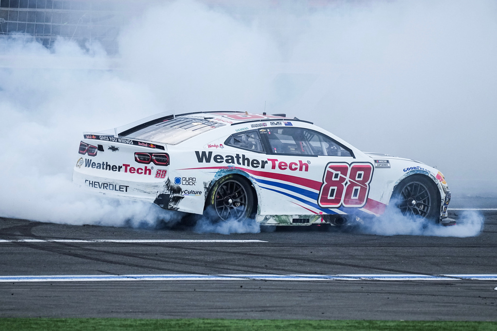 Shane van Gisbergen does a burnout after winning a NASCAR Cup Series auto race at Charlotte Motor Speedway, Sunday, Oct. 5, 2025, in Concord, N.C. (AP Photo/Matt Kelley)