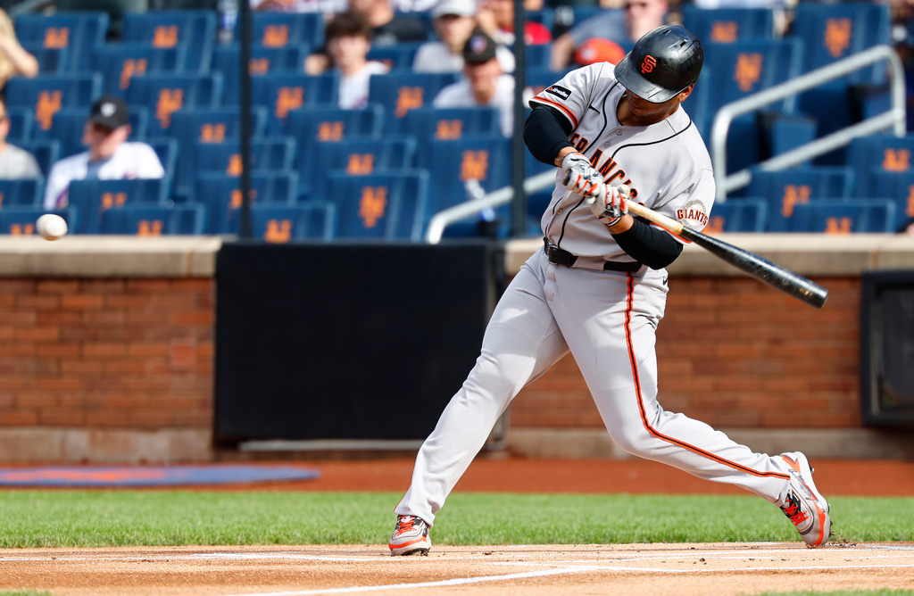 San Francisco Giants' Rafael Devers hits a home run against the New York Mets during the first inning of a baseball game, Saturday, Sept. 5, 2026, in New York. (AP Photo/Noah K. Murray)