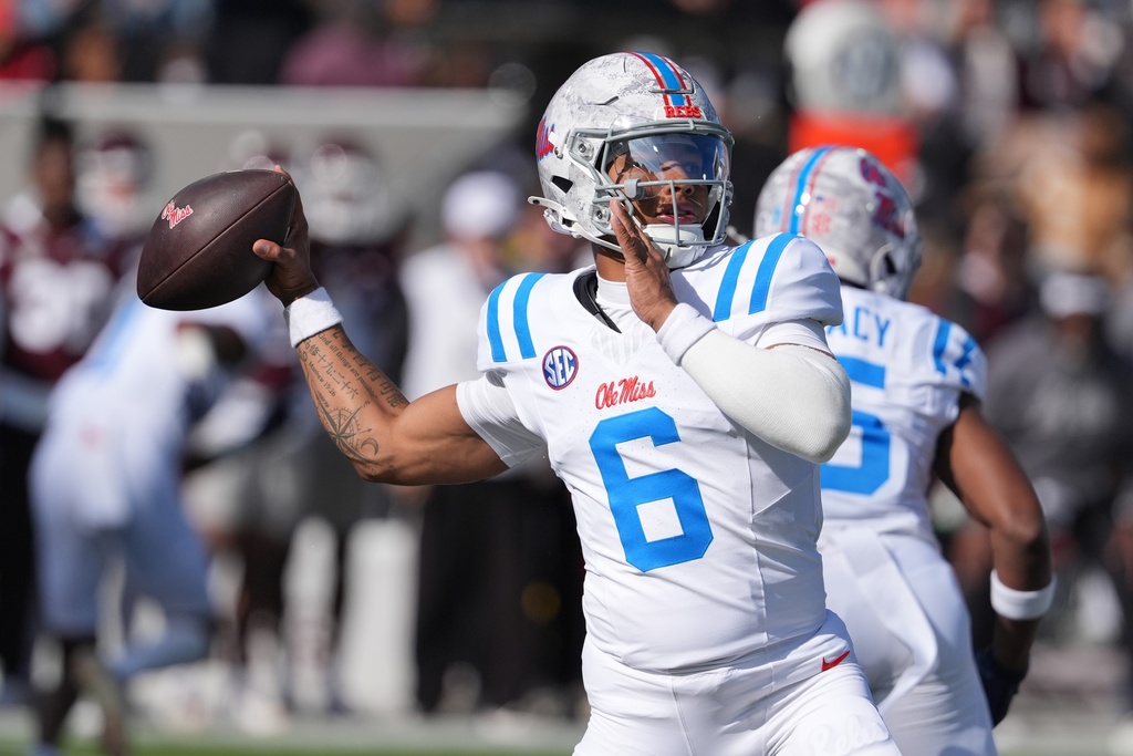 Mississippi quarterback Trinidad Chambliss (6) passes the football during the first half of an NCAA college football game against Mississippi State, Friday, Nov. 28, 2025, in Starkville, Miss. (AP Photo/Rogelio V. Solis)