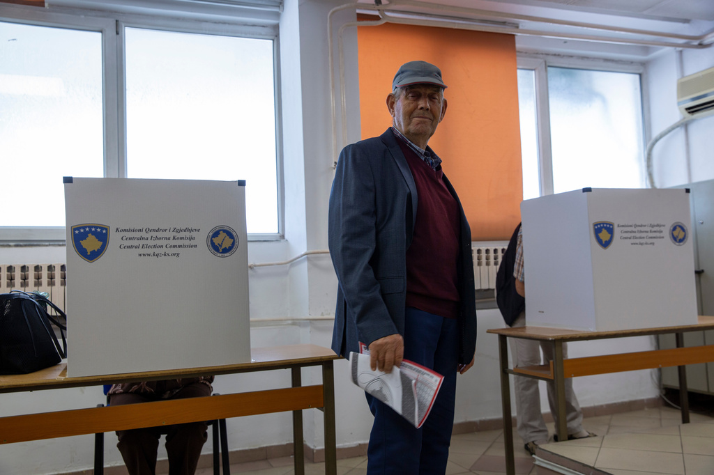 A man votes during parliamentary election in Kosovo capital Pristina, on Sunday, June 7, 2026. (AP Photo/Visar Kryeziu)