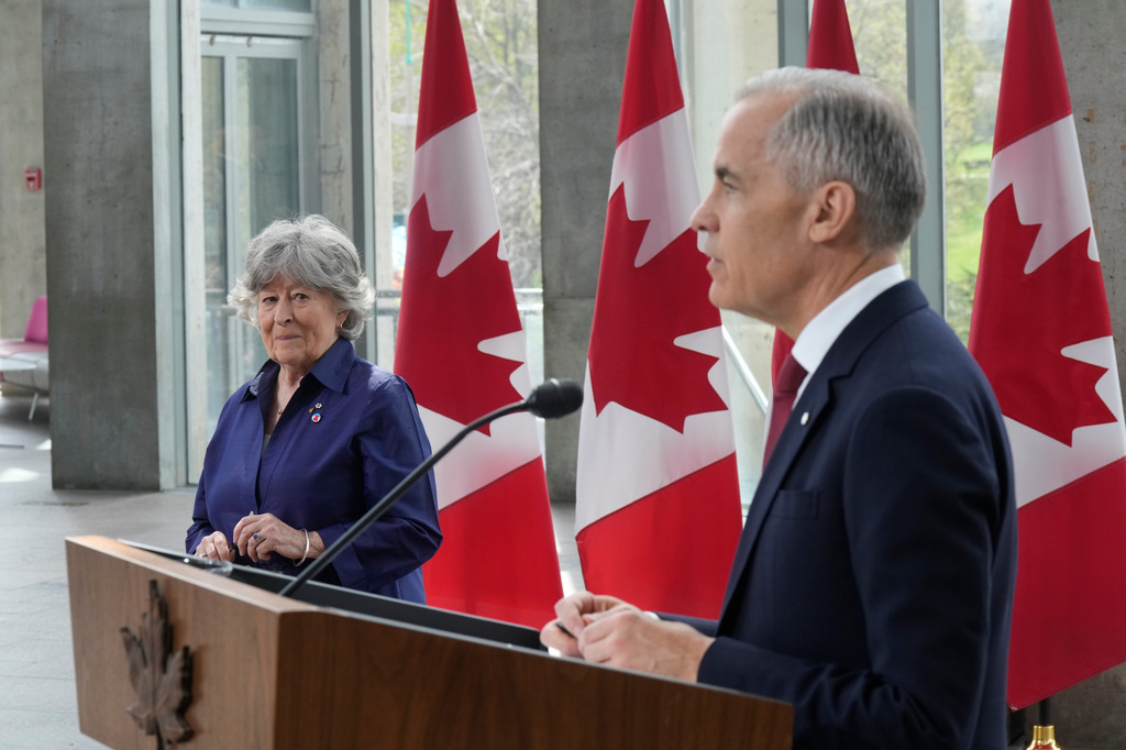 Canada Prime Minister Mark Carney and Louise Arbour take part in an announcement in Ottawa on Tuesday, May 5, 2026. (Adrian Wyld/The Canadian Press via AP)