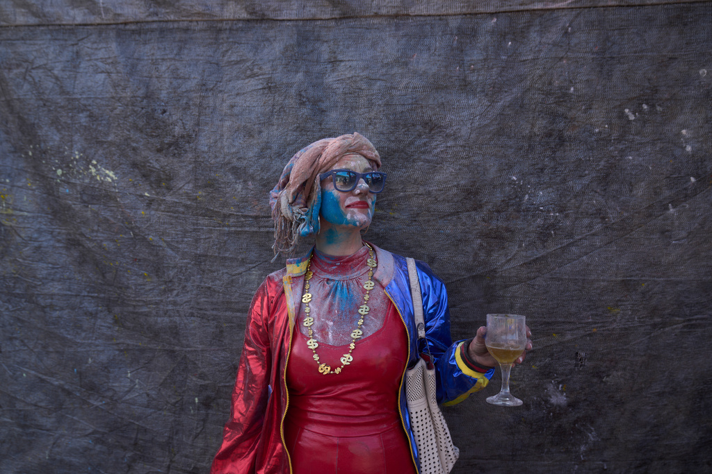 Emelia Mardaki, age 45, poses for a photograph as she participates in the annual flour war marking the end of the Carnival season on Clean Monday in Galaxidi, about 200 kilometers (120 miles) west of Athens, Monday Feb. 23, 2026, at the start of the 40-day Christian Lent fast leading to Easter. (AP Photo/Petros Giannakouris)