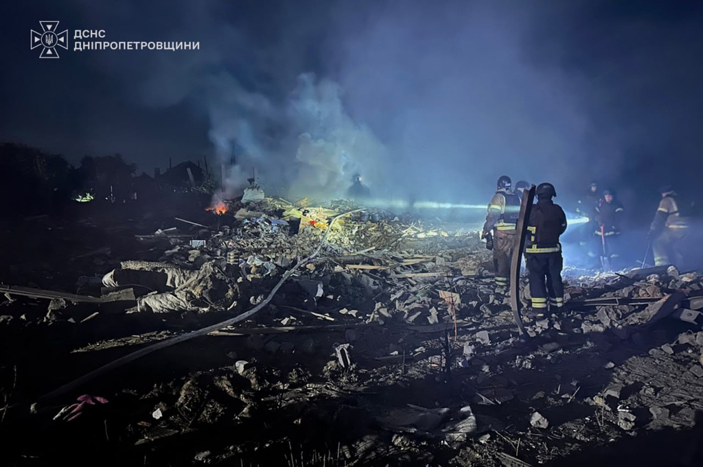 In this photo provided by the Ukrainian Emergency Service, rescuers search through the rubble at a private house following Russian air attack in Dnipropetrovsk region, Ukraine, Thursday, July 30, 2026. (Ukrainian Emergency Service via AP)