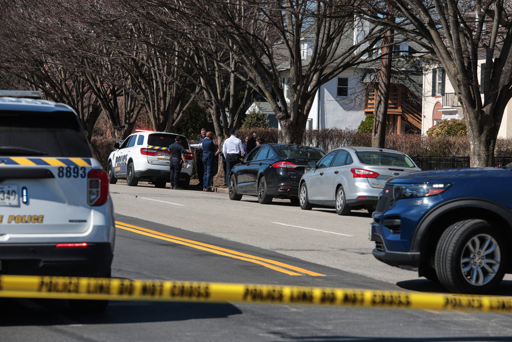 Investigators are seen near the scene of a shooting Tuesday, March 10, 2026, in Baltimore. (AP Photo/KT Kanazawich)