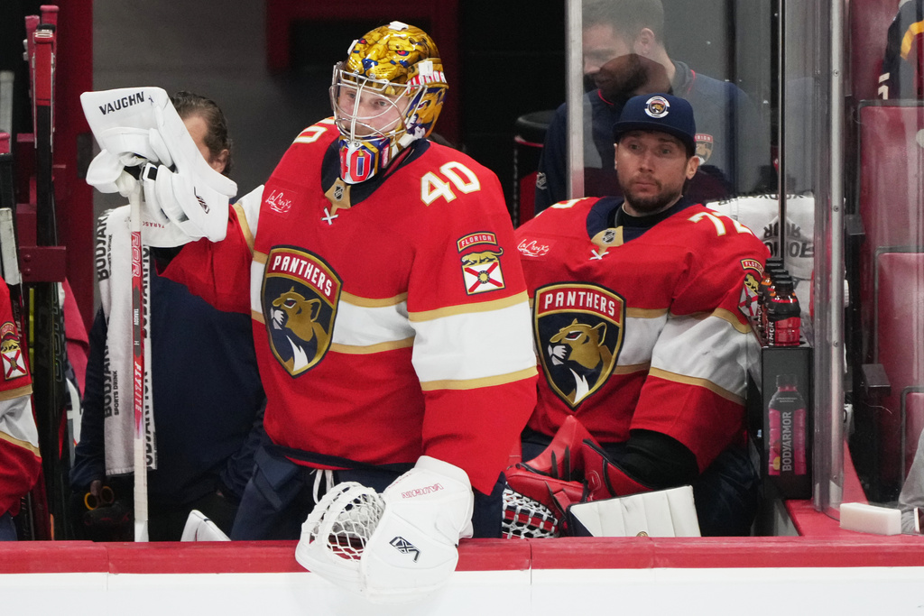Florida Panthers goaltenders Daniil Tarasov (40) and Sergei Bobrovsky (72) watch after Edmonton Oilers center Connor McDavid scored an empty net goal during the third period of an NHL hockey game, Saturday, Nov. 22, 2025, in Sunrise, Fla. (AP Photo/Lynne Sladky)