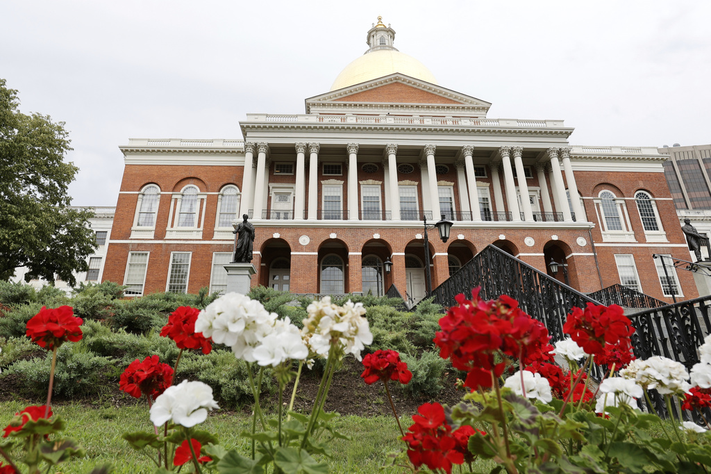 FILE - Flowers adorn the lawn in front of the Massachusetts State House, July 24, 2024, in Boston. (AP Photo/Mary Schwalm, File)