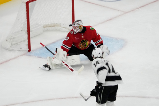 Los Angeles Kings right wing Alex Laferriere (14) scores a goal against Chicago Blackhawks goaltender Arvid Soderblom, top, during the second period of an NHL hockey game Sunday, Oct. 26, 2025, in Chicago. (AP Photo/David Banks) Los Angeles Kings right wing Alex Laferriere (14) scores a goal against Chicago Blackhawks goaltender Arvid Soderblom, top, during the second period of an NHL hockey game Sunday, Oct. 26, 2025, in Chicago. (AP Photo/David Banks)