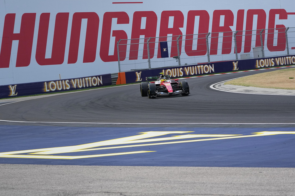 Britain's Lewis Hamilton steers his Ferrari during the first practice session ahead of Sunday's Formula One Hungarian Grand Prix auto race, at the Hungaroring racetrack in Mogyorod, near Budapest, Hungary, Friday, July 24, 2026. (AP Photo/Darko Vojinovic)