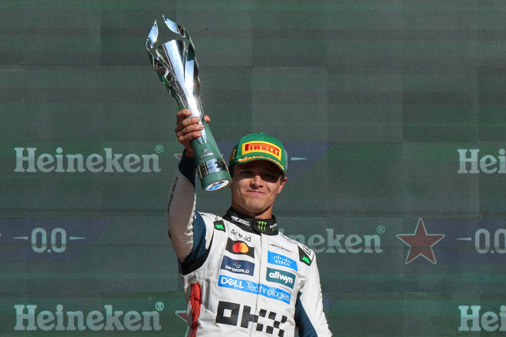 McLaren driver Lando Norris of Britain celebrates after winning the Formula One Mexico Grand Prix in Mexico City, Sunday, Oct. 26, 2025. (AP Photo/Fernando Llano)