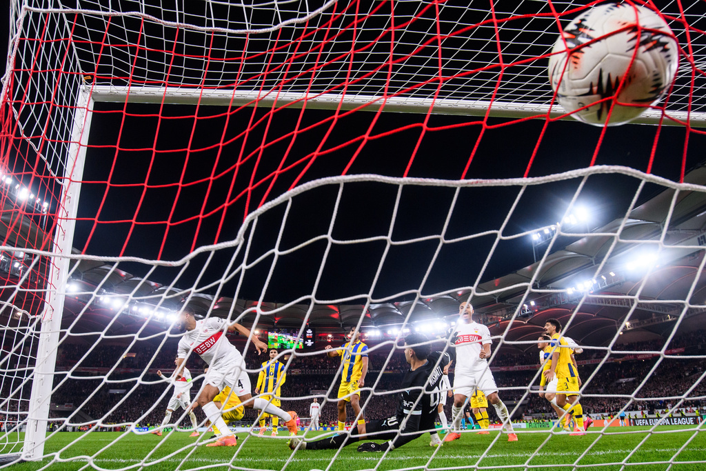 Stuttgart's Josha Vagnoman, left, scores his side's fourth goal during the Europa League opening phase soccer match between VfB Stuttgart and Maccabi Tel-Aviv FC in Stuttgart, Germany, Thursday, Dec. 11, 2025. (Tom Weller/dpa via AP)