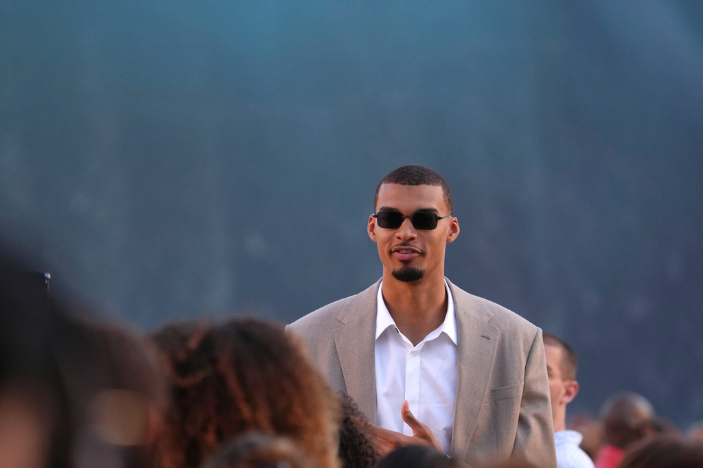 Victor Wembanyama arrives for the Louis Vuitton men's Spring Summer 2027 collection presented in Paris, France, Tuesday, June 23, 2026. (AP Photo/Aurelien Morissard)