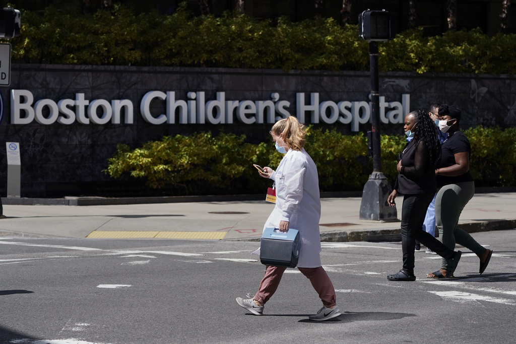 FILE - Pedestrians walk past the Boston Children's Hospital, Aug. 18, 2022, in Boston. (AP Photo/Charles Krupa, File)