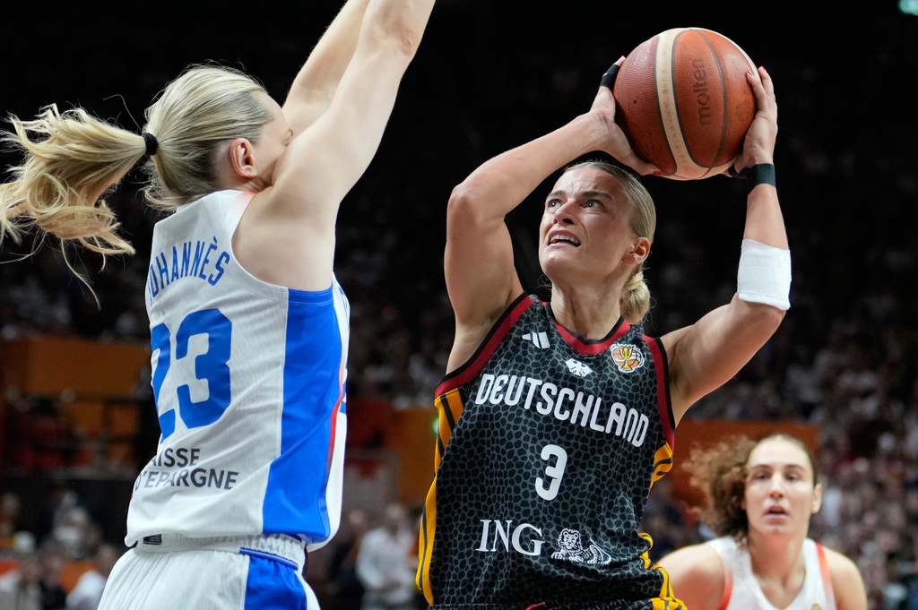 France's Marine Johannes guards Germany's Alexandra Wilke during the Women's Basketball World Cup semifinal match between France and Germany in Berlin, Saturday, Sept. 12, 2026. (AP Photo/Ebrahim Noroozi)