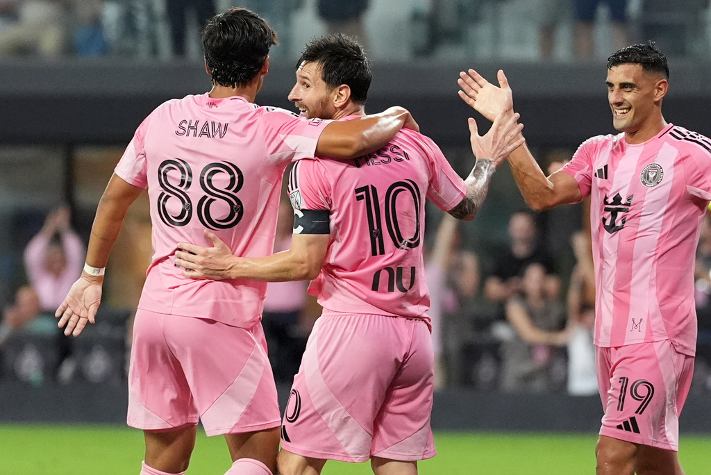 Inter Miami forward Lionel Messi (10) celebrates with forward German Berterame (19), and midfielder Alexander Shaw (88) after scoring his third goal of the match, his side's fifth, during the second half of an MLS soccer match, Saturday, Aug. 29, 2026, in Miami. (AP Photo/Rebecca Blackwell)