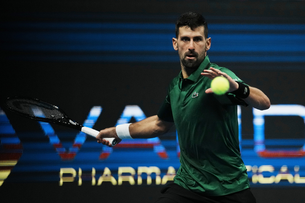 FILE - Novak Djokovic, of Serbia, plays a shot against Yannick Hanfmann, of Germany, during the ATP250 tournament semifinal tennis match in Athens, Greece, Nov. 7, 2025. (AP Photo/Thanassis Stavrakis, File)