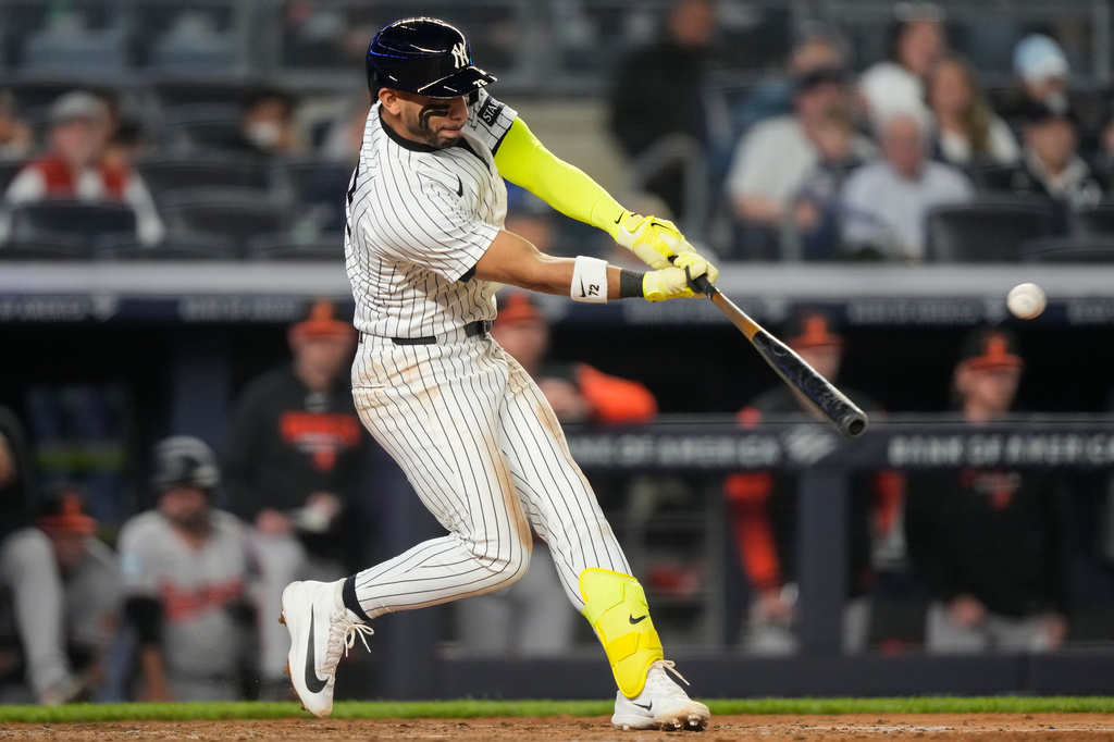 New York Yankees' Jose Caballero hits an RBI double during the sixth inning of a baseball game against Baltimore Orioles, Monday, May 4, 2026, in New York. (AP Photo/Yuki Iwamura)