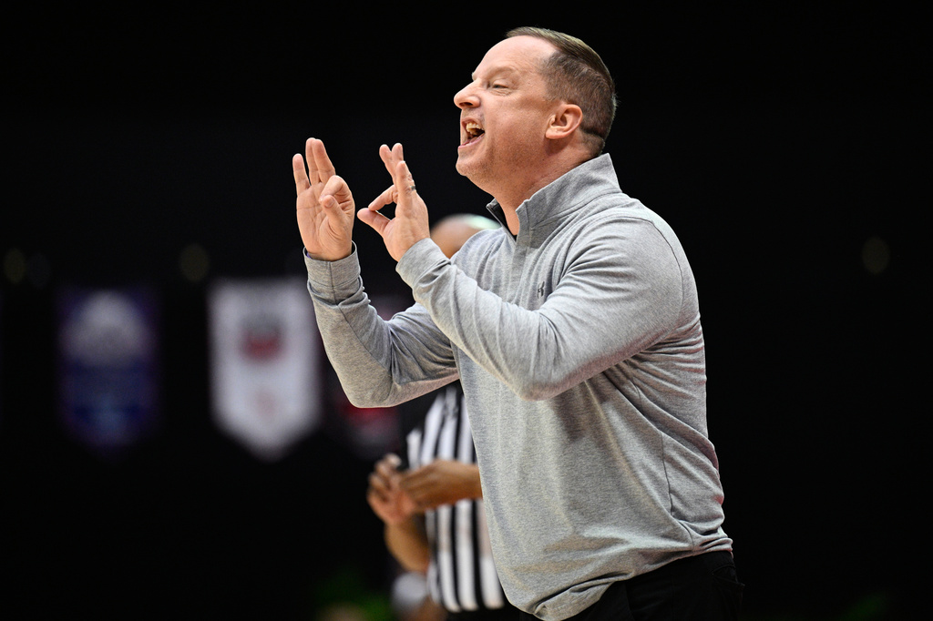 FILE - Wichita State head coach Paul Mills calls out instructions against Florida during the first half of an NCAA college basketball game, Nov. 29, 2024, in Kissimmee, Fla. (AP Photo/Phelan M. Ebenhack, File)