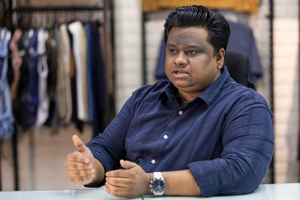 Alvi Islam, director of Arrival Fashion Limited, talks to The Associated Press, in Dhaka, Bangladesh, Tuesday, April 28, 2026. (AP Photo/Abdul Goni)