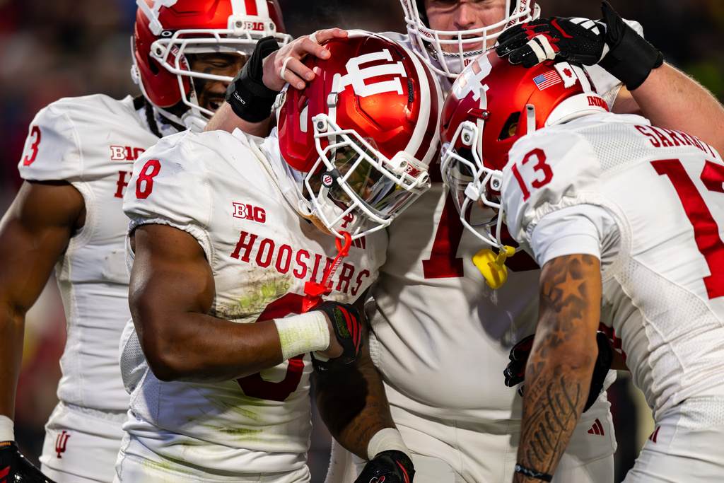 Indiana running back Kaelon Black (8) celebrates with teammates after scoring during the first half of an NCAA college football game against Purdue, Friday, Nov. 28, 2025, in West Lafayette, Ind. (AP Photo/Doug McSchooler)