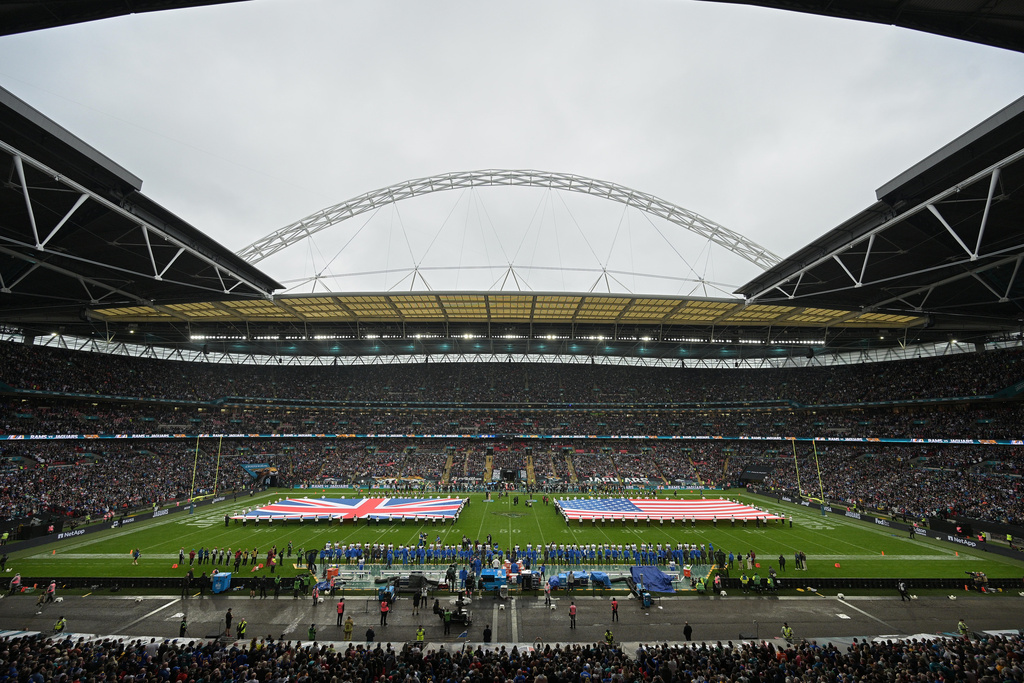 FILE - A general view of the flags of Britain and the United States on the field of Wembley stadium before an NFL football game between the Los Angeles Rams and the Jacksonville Jaguars in London, Sunday, Oct. 19, 2025. (AP Photo/Anthony Upton, File)