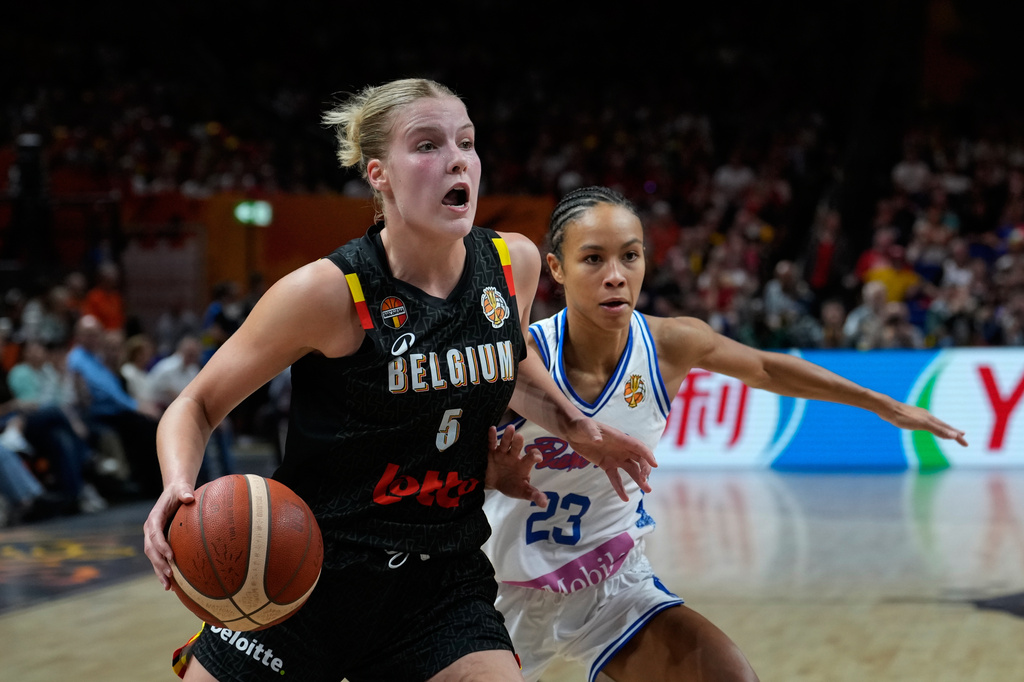 Trinity San Antonio guards Belgium's Nastja Claessens during the Women's Basketball World Cup match between Puerto Rico and Belgium in Berlin, Sunday, Sept. 6, 2026. (AP Photo/Ebrahim Noroozi)