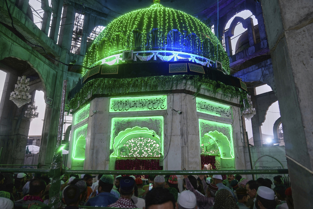 Devotees attend celebrations of the three-day annual festival or 'Urs' of mystic and scholar Hazrat Ali Hajveri, popularly known as Data Ganj Bakhsh at his shrine, in Lahore, Pakistan, Wednesday, Aug. 13, 2025. (AP Photo/K.M. Chaudary)
