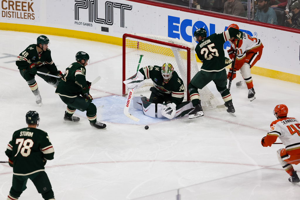 Minnesota Wild's Jesper Wallstedt (30) defends the net against the Anaheim Ducks during the second period of an NHL hockey game Tuesday, April 14, 2026, in St. Paul, Minn. (AP Photo/Lily Dozier)