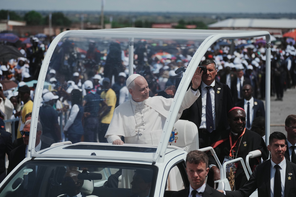 Pope Leo XIV is cheered by faithful as he arrives to celebrate a mass at Saurimo esplanade, Angola, Monday, April 20, 2026. (AP Photo/Andrew Medichini)