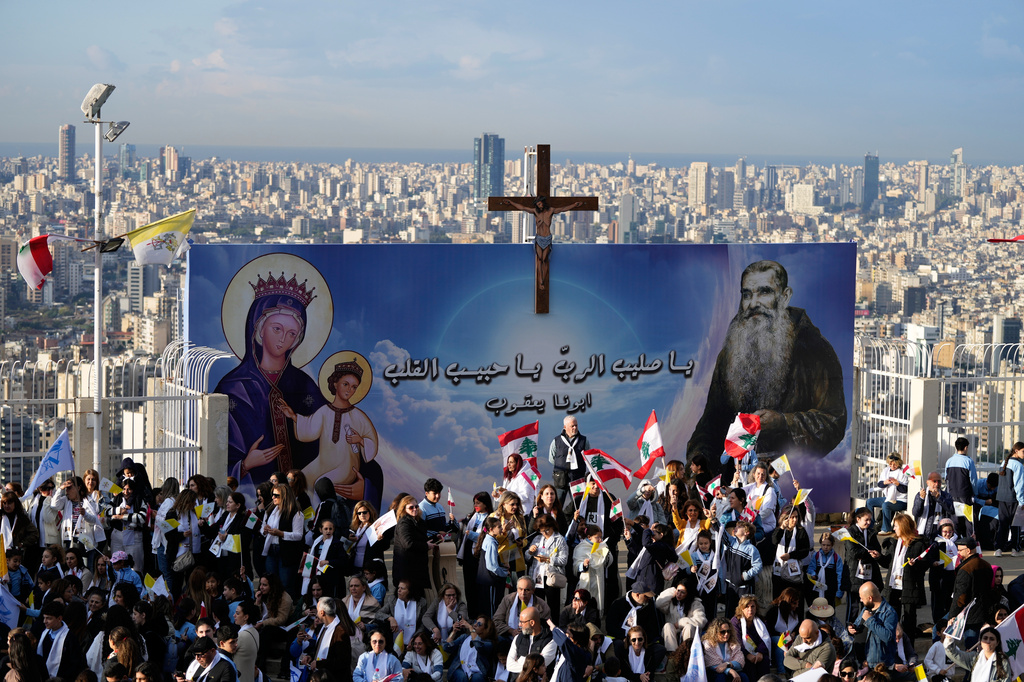 Crowds gather for the arrival of Pope Leo XIV who will visit the De la Croix hospital in Jal el Dib, Lebanon, Tuesday, Dec. 2, 2025. (AP Photo/Hassan Ammar)
