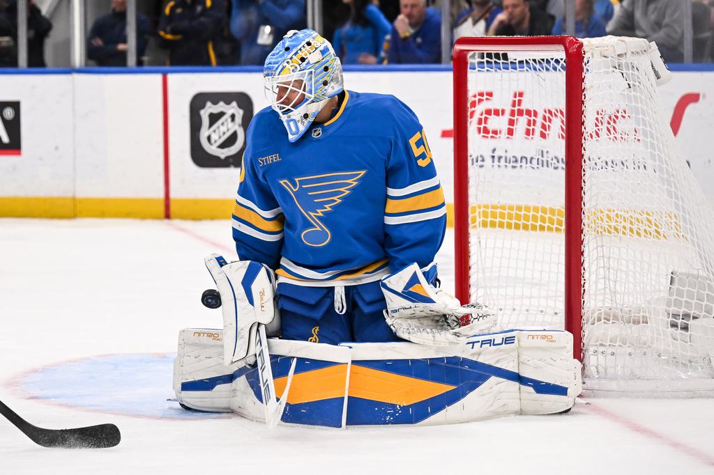 St. Louis Blues goaltender Jordan Binnington (50) makes a save during the third period of an NHL hockey game against the Winnipeg Jets Thursday, April 9, 2026, in St. Louis. (AP Photo/Connor Hamilton)