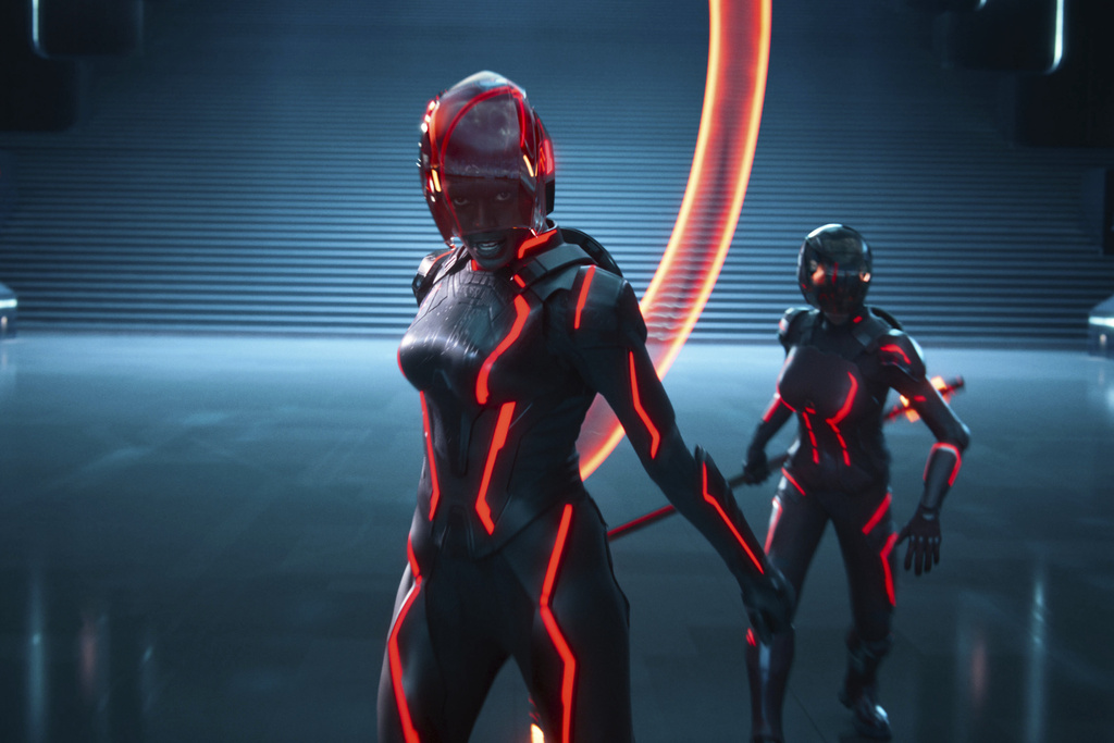 This image released by Disney shows Jodie Turner-Smith, center, in a scene from "Tron: Ares." (Disney via AP)