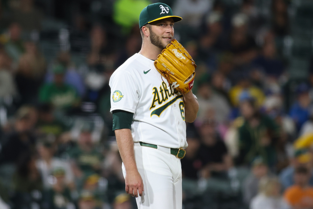 Athletics pitcher Justin Sterner reacts after a bunt single by Kansas City Royals Kyle Isbel during the 10th inning of a baseball game Tuesday, April 28, 2026, in West Sacramento, Calif. (AP Photo/Scott Marshall)