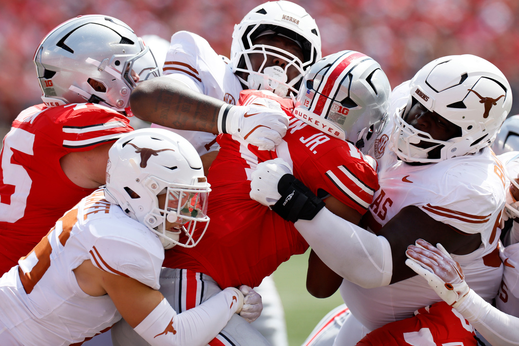 FILE - Ohio State running back CJ Donaldson is stopped by the Texas defense during the second half of an NCAA college football game in Columbus, Ohio., Aug. 30, 2025. (AP Photo/Jay LaPrete, File)