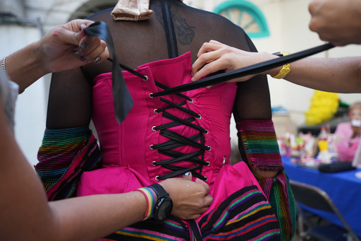Drag artists prepare a costume ahead of the annual Day of the Dead Catrina parade in Mexico City, Sunday, Oct. 26, 2025. (AP Photo/Claudia Rosel) Drag artists prepare a costume ahead of the annual Day of the Dead Catrina parade in Mexico City, Sunday, Oct. 26, 2025. (AP Photo/Claudia Rosel)
