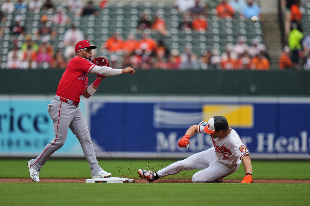 Los Angeles Angels second baseman Oswald Peraza, left, throws to first after forcing out Baltimore Orioles' Gunnar Henderson at second base during a double play in the first inning of a baseball game, Thursday, Aug. 6, 2026, in Baltimore. (AP Photo/Stephanie Scarbrough)