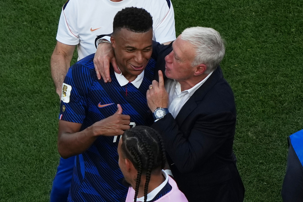France's Kylian Mbappe, left, and France head coach Didier Deschamps celebrate after the World Cup round of 16 soccer match against Paraguay in Philadelphia, Saturday, July 4, 2026. (AP Photo/Matt Rourke)