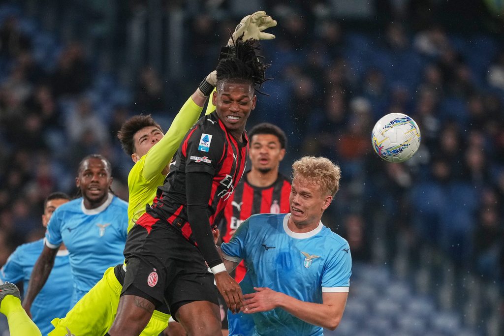 Lazio's goalkeeper Edoardo Motta makes a save against AC Milan's Rafael Leao, centre, during a Serie A soccer match between Lazio and Milan, in Rome, Italy, Sunday, March 15, 2026. (AP Photo/Andrew Medichini)