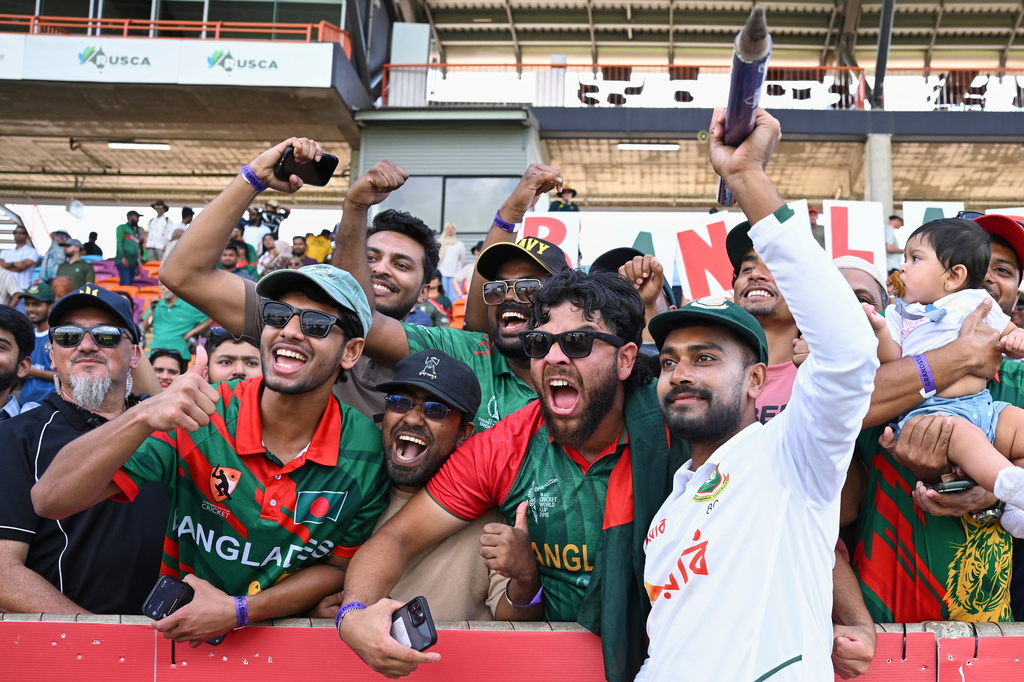 Mehidy Hasan Miraz of Bangladesh celebrates with fans after defeating Australia on day four of the first cricket test in Darwin, Australia, Sunday, Aug. 16, 2026. (James Ross/AAP Image via AP)