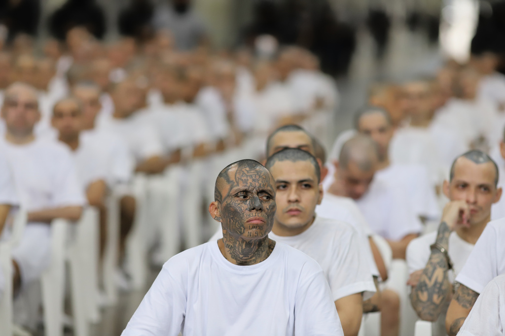 Alleged gang members take part in a mass trial at the Terrorism Confinement Center (CECOT) in Tecoluca, El Salvador, Thursday, April 23, 2026. (AP Photo/Salvador Melendez)