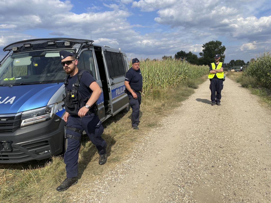 Police secure the area of a cornfield where an unidentified flying object has crashed and exploded in the country's east in Osiny, Poland, Wednesday, Aug. 20, 2025. (AP Photo)