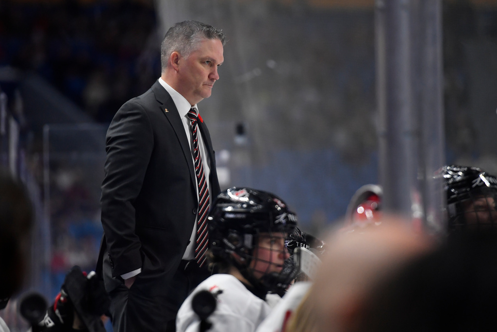 Canada head coach Troy Ryan watches play during the second period of a Rivalry Series women's hockey game against the United States, Saturday, Nov. 8, 2025, in Buffalo, N.Y. (AP Photo/Adrian Kraus)