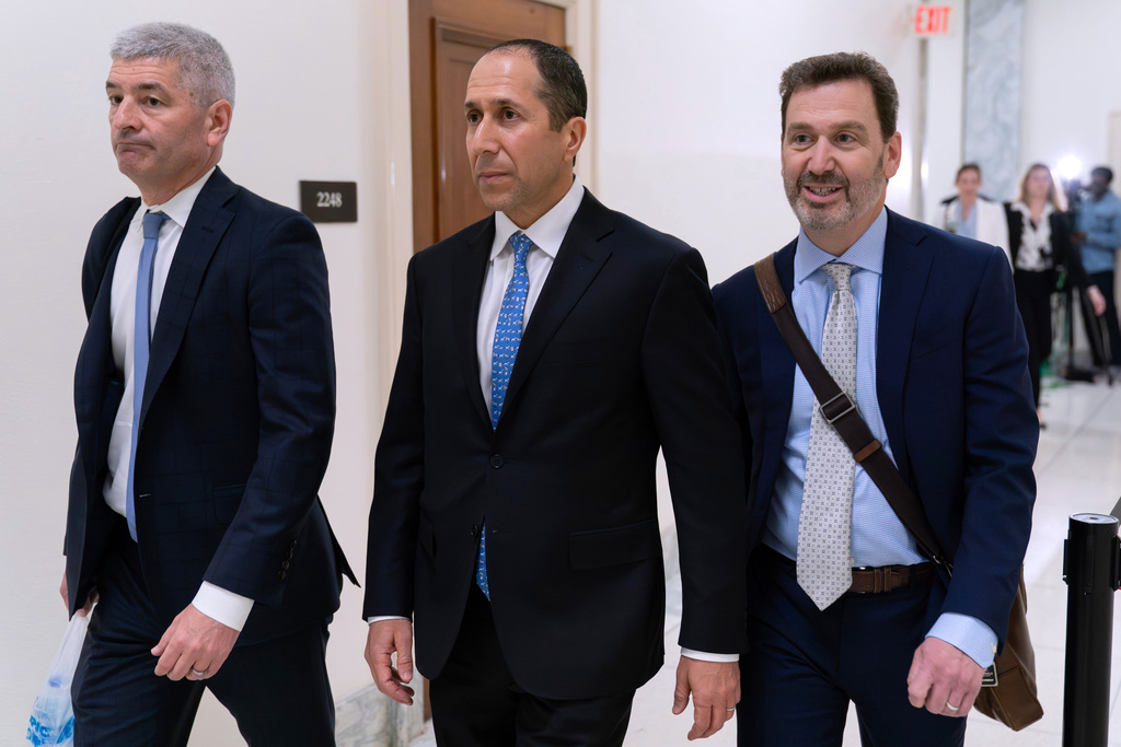 Richard Khan, center, Jeffrey Epstein's accountant and co-executor of his estate, arrives for his deposition before the House Oversight Committee on Capitol Hill, Wednesday, March 11, 2026, in Washington. (AP Photo/Jose Luis Magana)