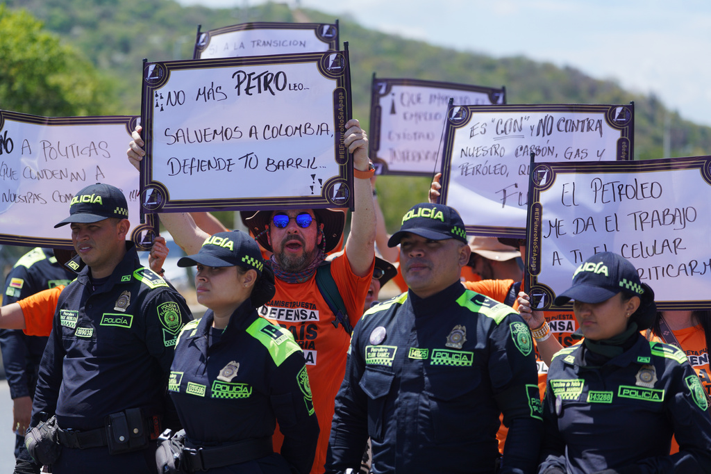 Activists participate in a pro-oil demonstration and against President Gustavo Petro, of Colombia, outside of a conference aimed at transitioning away from fossil fuels Tuesday, April 28, 2026, in Santa Marta, Colombia. (AP Photo/Ivan Valencia)