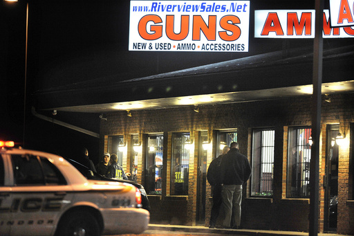 FILE - In this Dec. 20, 2012 file photo, law enforcement officials stand outside Riverview Gun Sales, as authorities raid the store in East Windsor, Conn. (AP Photo/Jessica Hill, File) FILE - In this Dec. 20, 2012 file photo, law enforcement officials stand outside Riverview Gun Sales, as authorities raid the store in East Windsor, Conn. (AP Photo/Jessica Hill, File)
