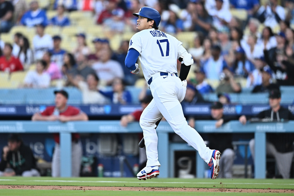 Los Angeles Dodgers' Shohei Ohtani watches his home run during the first inning of a baseball game against the Arizona Diamondbacks, Friday, July 10, 2026, in Los Angeles. (AP Photo/William Liang)
